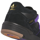Close-up of a Kader Black Purple KI0408 Adidas Skateboarding Suede Leather shoe, showing a durable black suede and leather heel with gold branding, the name KADER on the side, a purple strap, and a gum-colored rubber outsole.