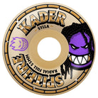 The Kader Rolly 55mm 99A F4 Spitfire Wheels showcase bold gold KADER SYLLA text, a vivid purple face with dreadlocks and sharp teeth, and a dynamic purple flame graphic, all set on a beige wheel with SPITFIRE RADIAL FULL 55MM branding around the edge—delivering signature Kader Rolly style to your setup. Also offered in a 53mm option for varied performance.