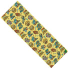 A rectangular yellow grip tape mat, 11" x 33", with a diagonal Killer Acid Doodles of Summer pattern featuring colorful cartoon turtles, leaves, and circles. From Graphic Mob.