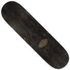 An overhead view of the Kyle Black Sun Cathedral 8.38x32.25 Real Skateboard Deck reveals a black wood finish with a subtle grain pattern and a small oval logo near one end, exemplifying understated style and quality craftsmanship.
