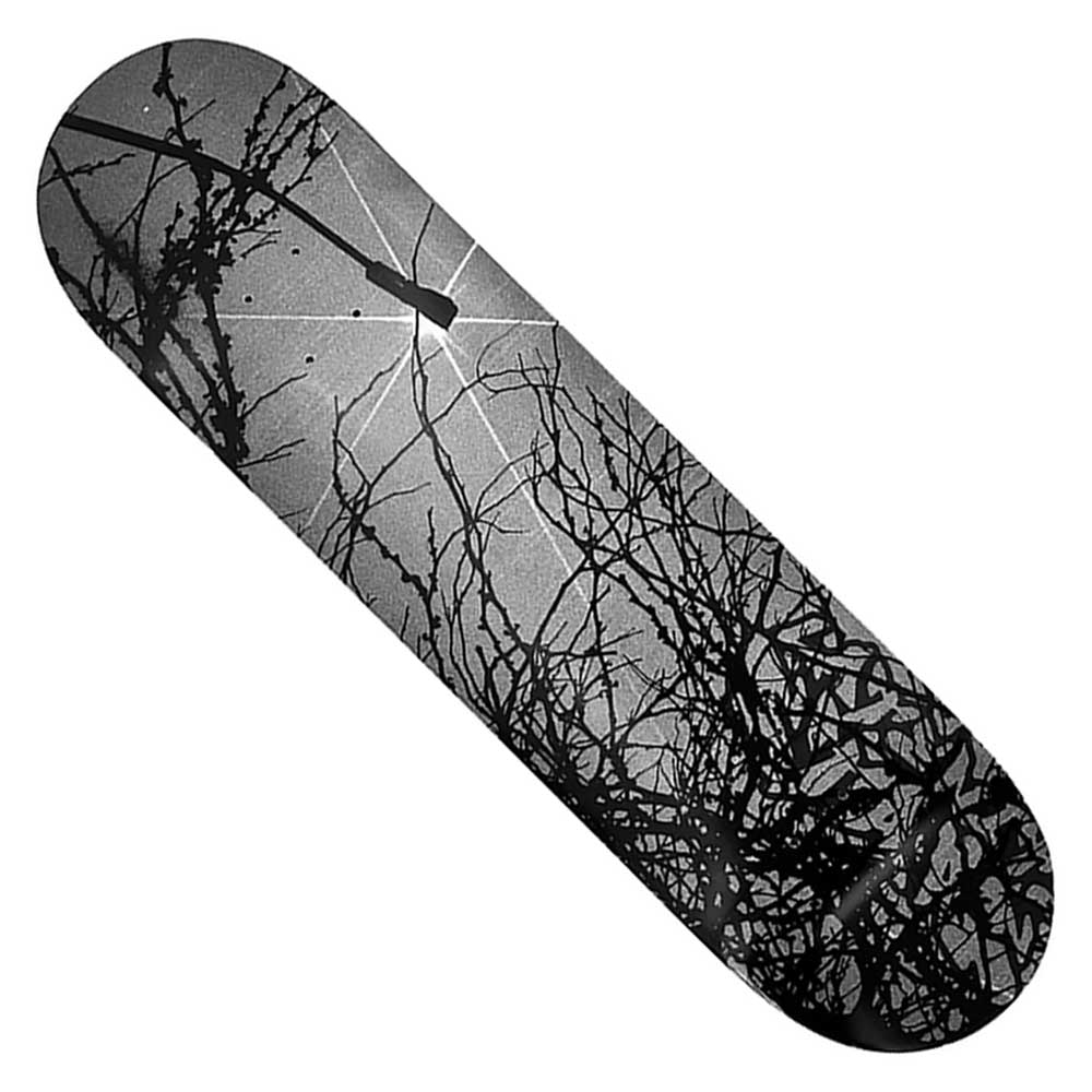 The LNS Roots 8.5x32.3 Gray Black Deck Late Nite Stars Skateboard features a striking black-and-gray design with tangled, leafless branches and a glowing sun or moon on a cloudy sky background.