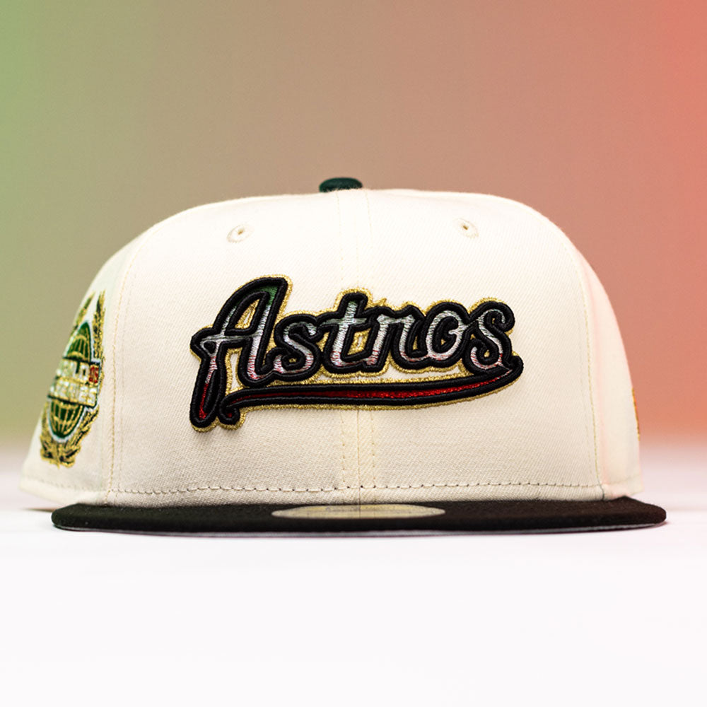 Show your Houston Astros pride with the La Cumbia WS05 Chrome Black Mexico Houston Astros New Era Hat 5950 Fitted. This cream and black fitted cap features “Astros” embroidered on the front in bold black, red, and yellow, accented by a vibrant side patch. The background transitions from green to red for a striking Chrome Black look.