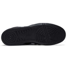 The image shows the black rubber outsole of Leggerezza Asics Black Bright White 1201B045 leather skateboarding shoes, with circular tread at the heel and forefoot, straight and curved grooves for traction, and 'spike' embossed in the center.