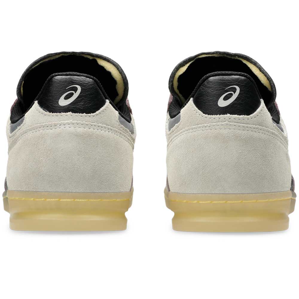 Back view of Leggerezza Asics Oyster Grey Black 1203B087 020 Suede Skateboarding Shoes with a light beige suede upper, black heel tabs with white ASICS logo, and translucent gum soles—echoing classic Asics soccer cleat design.