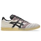 A side view of the Leggerezza Asics Oyster Grey Black 1203B087 020 Suede Skateboarding Shoes, featuring a beige suede upper, black laces and stripes, mauve overlays, a translucent sole, and breathable mesh accents for comfort.