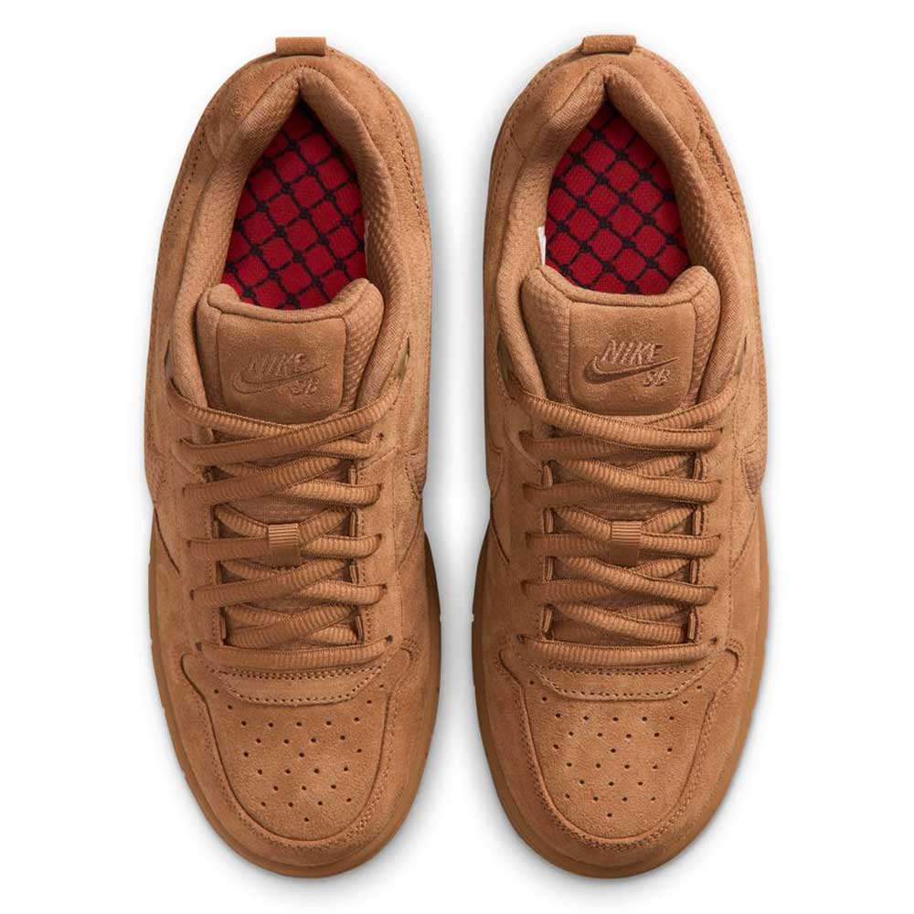 A top view of the Light British Tan IQ6827200 Paul Rodriguez Zoom Air Low Suede Skateboarding Shoes by Nike, featuring a pair of brown suede sneakers with matching laces, a red patterned insole, leather detailing on the upper, and displayed side by side on a white background.