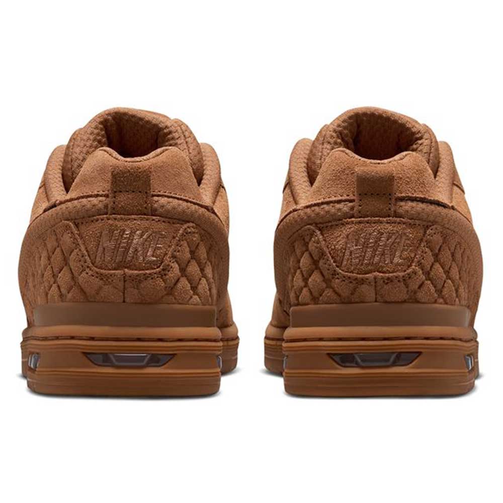 Two Light British Tan Paul Rodriguez Zoom Air Low Suede Skateboarding shoes are shown from the back, highlighting their quilted texture, stitched Nike logos on the heels, and durable rubber outsoles.