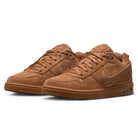 The Light British Tan IQ6827200 Paul Rodriguez Zoom Air Low Suede Skateboarding Shoes feature a rich suede texture, gum rubber soles, and quilted detailing on the heel. These Nike sneakers are designed with a durable rubber outsole for enhanced traction, and are displayed from a slight angle on a white background.