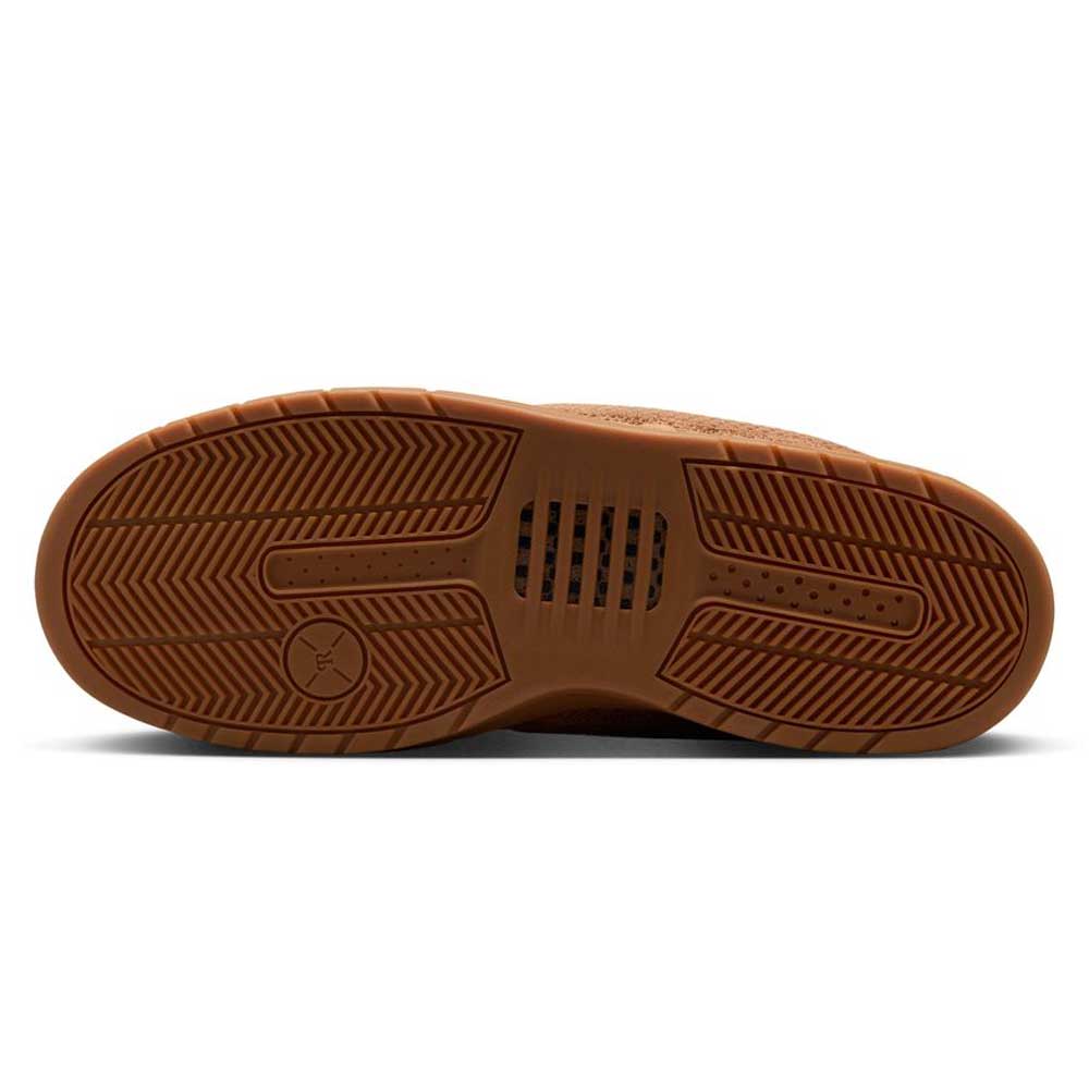 Light British Tan IQ6827200 Paul Rodriguez Zoom Air Low Suede Skateboarding Shoes feature a brown rubber outsole with a herringbone tread pattern, circular design near the heel, and small rectangular cutouts in the middle for enhanced grip and flexibility.