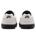 Back view of Light Orewood FV6064104 Malor Nike SB shoes with white uppers, black soles, black Nike SB heel logos, and black inner lining. Durable skate sneakers are placed side by side on a white background.