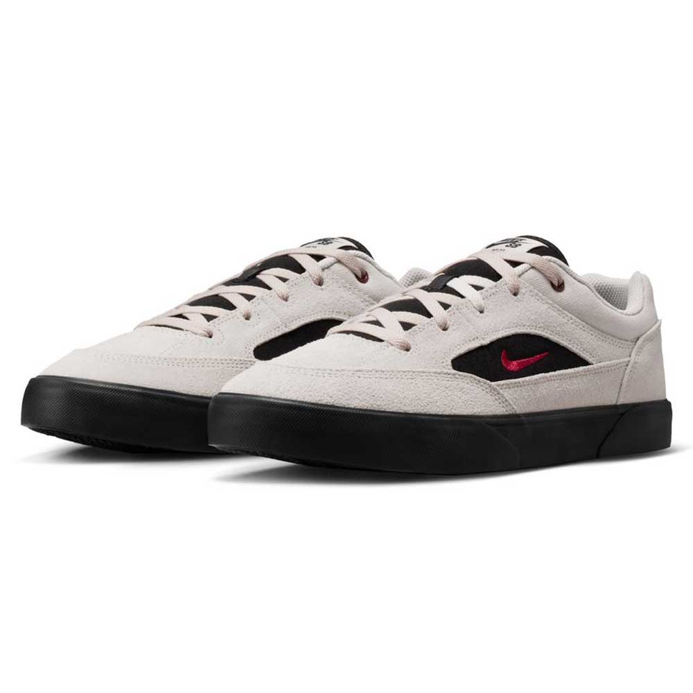 The Light Orewood FV6064104 Malor Nike SB Shoes are kids' skate sneakers in beige with black soles, black accents, and red Swoosh logos—combining style and durability for everyday wear. Displayed on a white background.