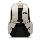 The Nike SB RPM Skate Backpack (Lt Orewood Brown Black, FD7544104) is shown from the back, with padded shoulder straps, adjustable chest strap, side pockets, small Nike logo on the left strap, and a laptop compartment.