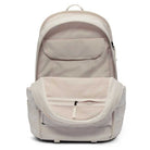 The Lt Orewood Brown Black FD7544104 Nike SB RPM Skate Backpack is shown open and empty, displaying interior pockets, a mesh zippered compartment, a laptop sleeve, organized storage sections, visible outer zippers, and a handle.