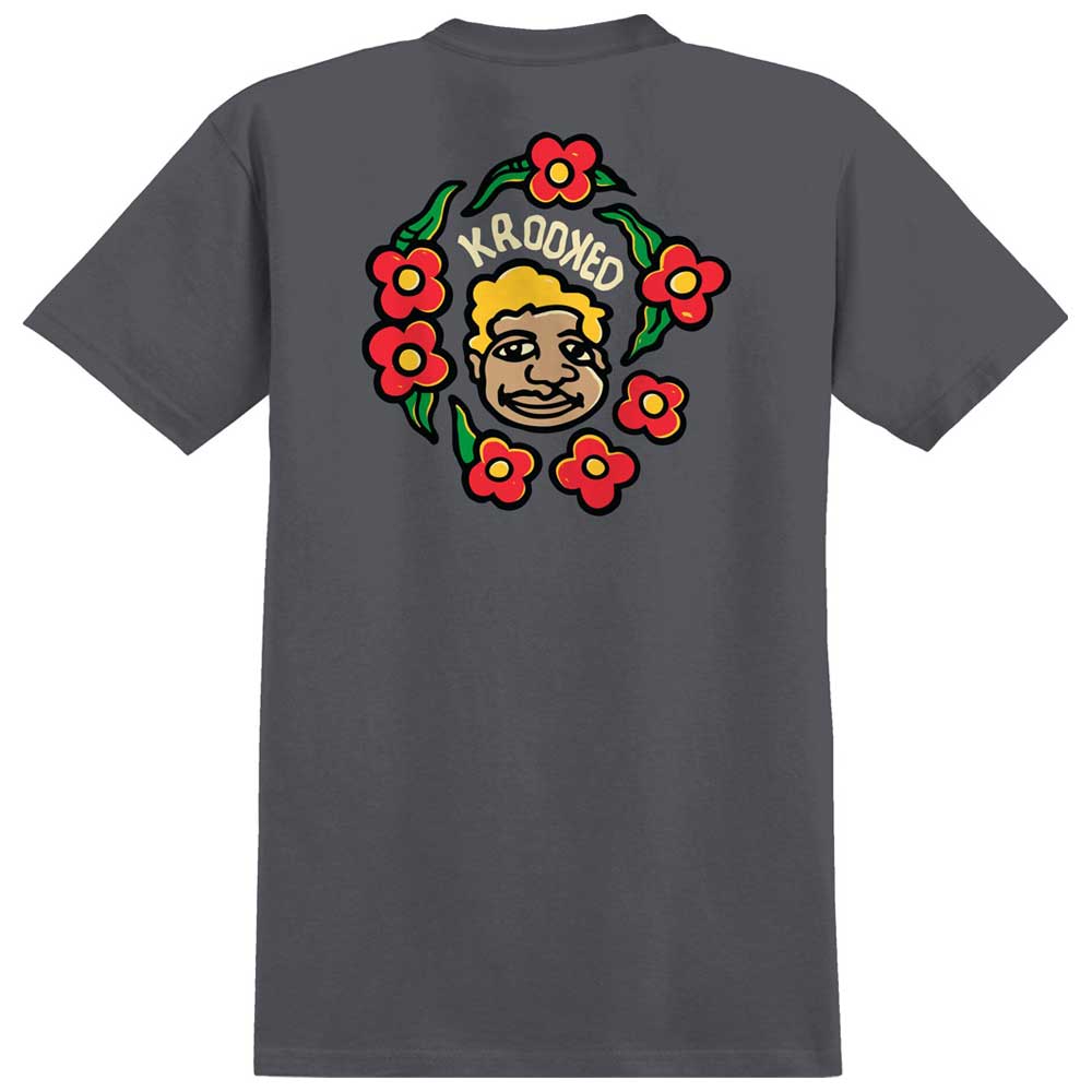 The MG Charcoal Black Multi Tee from Krooked Skateboards features a dark gray base with a cartoon face, red flowers, green leaves, and the word "KROOKED" on the back, inspired by the iconic Krooked Skateboards MG Multi Tee design.