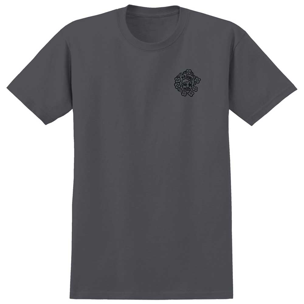 Introducing the MG Charcoal Black Multi Tee from Krooked Skateboards—a plain dark gray tee in Charcoal Black featuring a small black graphic of a stylized face surrounded by flowers on the left chest, inspired by Krooked’s iconic MG Multi Tee.