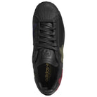 Top view of the Mark Gonzales Black Black Black LA6416 Superstar ADV x Gonz Adidas Skateboarding leather shoe, featuring a textured toe, black laces, and multicolor suede patches on the sides. The gold Adidas logo stands out on the black insole, emphasizing its stylish design as a premium skateboarding footwear option.