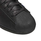 Close-up of the toe area of the Mark Gonzales Black Black Black LA6416 Superstar ADV x Gonz Adidas Skateboarding Leather Shoes Footwear, featuring a textured rubber shell and black laces, showcasing the classic design inspired by skateboarding shoes.