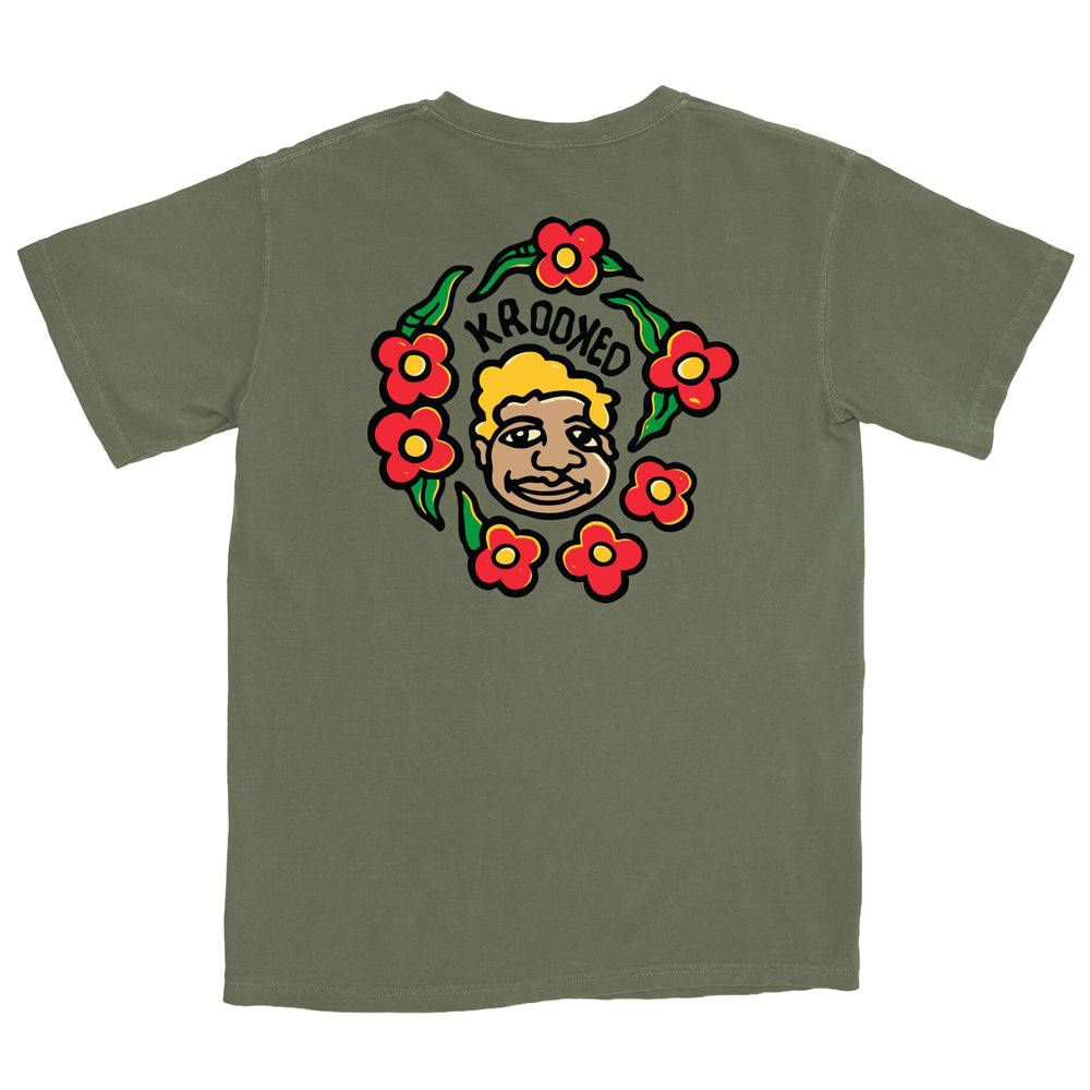 Mark Gonzales Moss Multicolor Krooked Skateboards tee in olive green featuring a back graphic of a cartoon face surrounded by red flowers and the word KROOKED in black lettering.