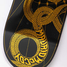 Close-up of the McCoy Snakes VX Deck 8.25in x 31.83in from Santa Cruz Skateboards—features a gold geometric snake on black, with MADRID MCGOY in its body, evoking the iconic style of this signature deck.