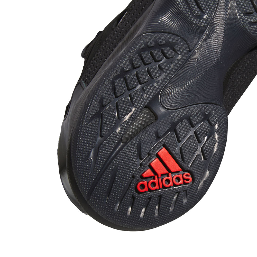 Close-up of the black sole of the Metalwood Predator Sala HP4953 Black Adidas Skateboarding Shoes, featuring textured grip patterns and a red Adidas logo near the heel—making it a standout choice for street culture enthusiasts.