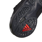 Close-up of the black sole of the Metalwood Predator Sala HP4953 Black Adidas Skateboarding Shoes, featuring textured grip patterns and a red Adidas logo near the heel—making it a standout choice for street culture enthusiasts.