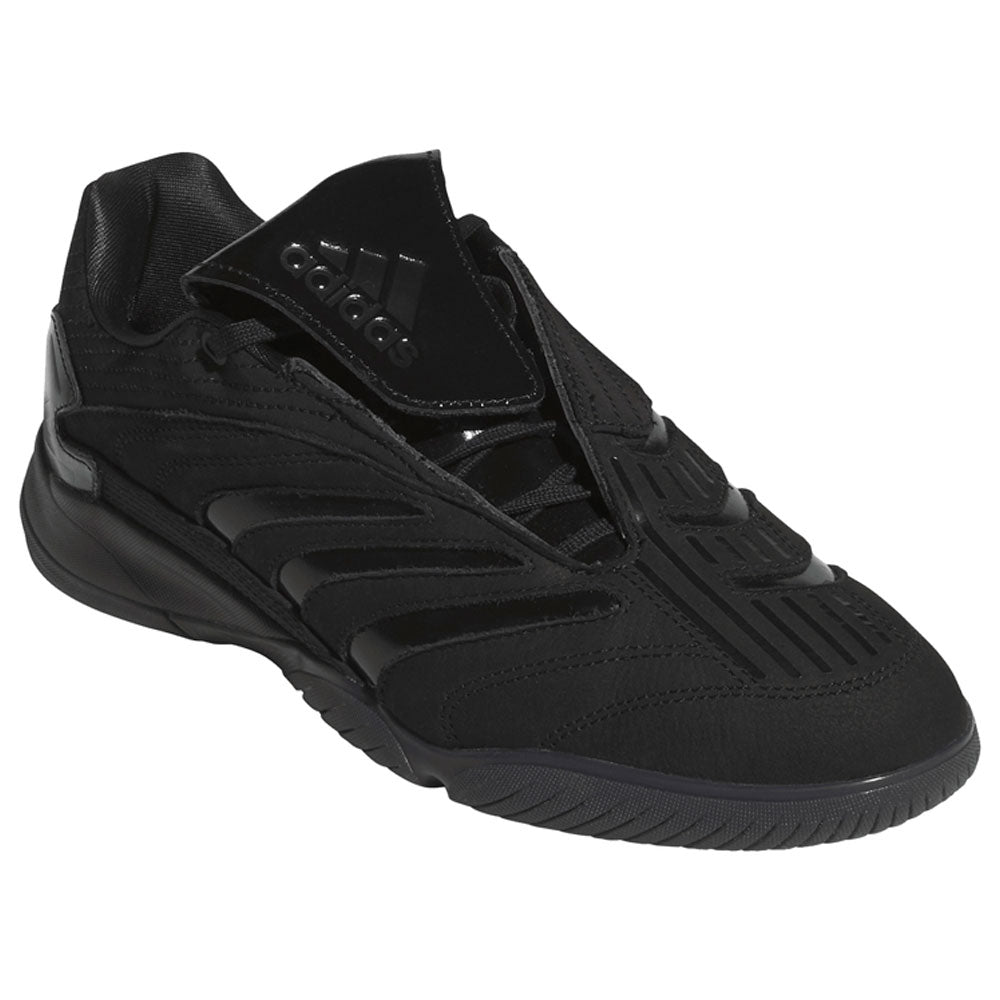Introducing the Metalwood Predator Sala HP4953 Black Adidas Skateboarding Shoes—a black Adidas sneaker featuring textured accents and a fold-over tongue adorned with the Adidas logo, displayed at an angle against a white background. This striking silhouette channels the essence of adidas Originals and takes inspiration from street culture sneakers.