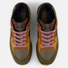 Top view of Mike Gigliotti True Brown Candy Pink 933 LOT New Balance Numeric suede skateboarding shoes with brown, olive green, mustard yellow, orange panels, black accents, and pink laces on a white background.