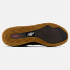 The image shows the bottom view of the Mike Gigliotti True Brown Candy Pink 933 LOT New Balance Numeric Suede Skateboarding Shoe with a gum-colored rubber sole, textured tread, a white New Balance logo at the center, and "NDurance" on the heel.