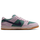 The Minereal Slate Dark Raisin Dunk Low Pro HQ1625300 Suede Skateboarding shoe features pink suede overlays, green mesh panels, a dark blue swoosh, and a light brown gum sole, shown in left profile against a white background.