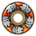 A skateboard wheel with a beige outer edge, fiery orange and red flames, and white cartoon faces with sharp grins. Text: Multiball 54mm99A Formula Four Spitfire Wheels OG Classic.