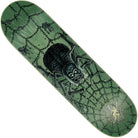 The Provost Dungeon Web Pro 8.47in x 31.98in Creature Skateboard Deck features a green design with a large black spider on a web, a gold human figure caught near the bottom right, and detailed chains and objects throughout.