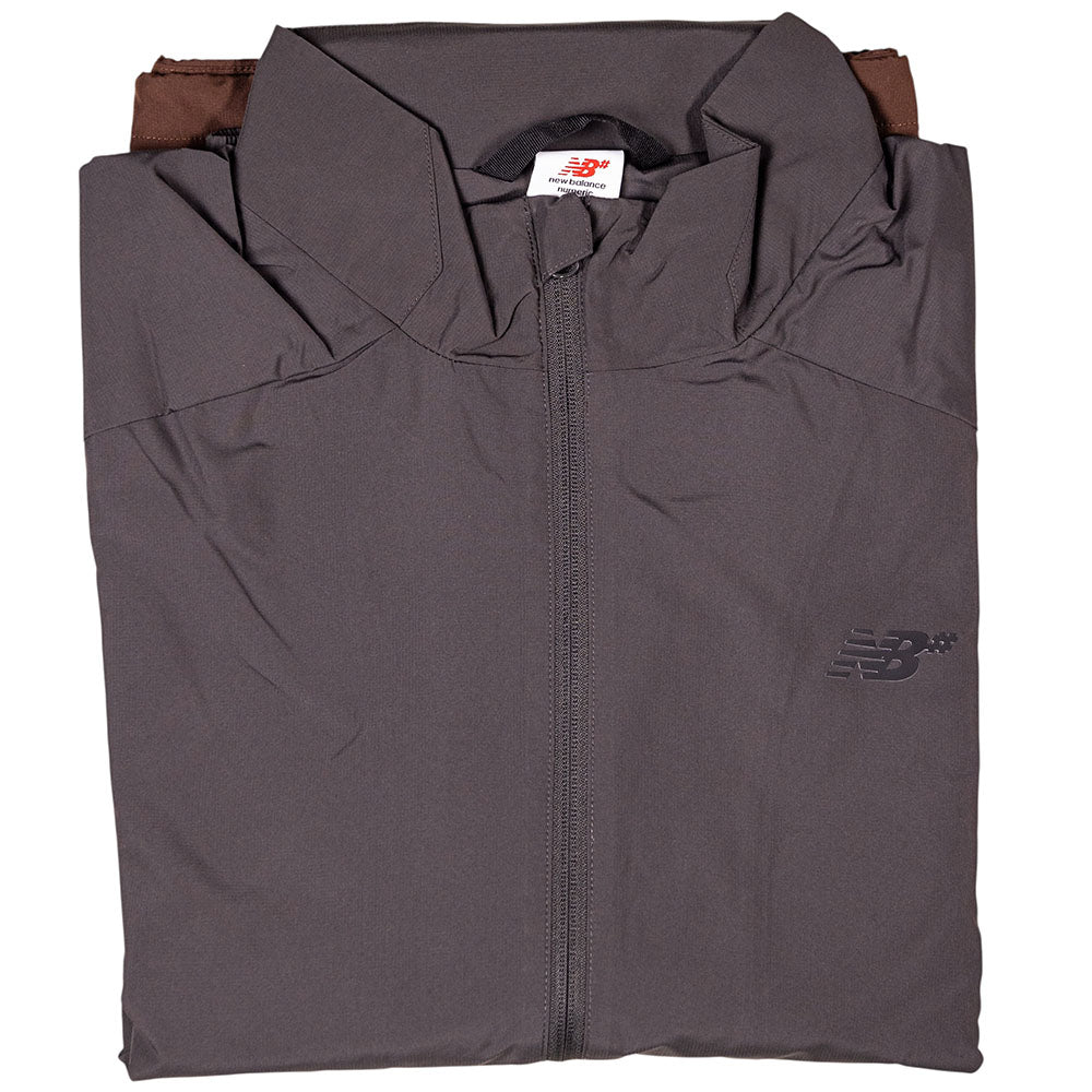 A folded New Balance Numeric Jacket MJ61W4XCABR in dark gray ripstop with a full front zipper and left chest logo, displayed against a white background.