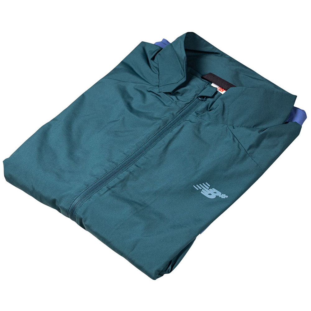 A folded teal New Balance Numeric Jacket MJ61W4XCAAV made from durable ripstop fabric, featuring a small white New Balance logo on the chest, displayed against a white background.