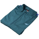 A folded teal New Balance Numeric Jacket MJ61W4XCAAV made from durable ripstop fabric, featuring a small white New Balance logo on the chest, displayed against a white background.