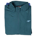 A folded New Balance Numeric Jacket MJ61W4XCAAV in dark green, featuring a front zipper, NB chest logo, and durable ripstop fabric, displayed on a white background.