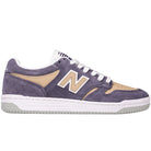 The 480 NAD New Balance Numeric Suede Skateboarding Shoe is displayed from a side view against a white background, featuring purple suede and beige leather panels, white laces, a white and gray sole with responsive FuelCell foam, and a white “N” logo on the side.