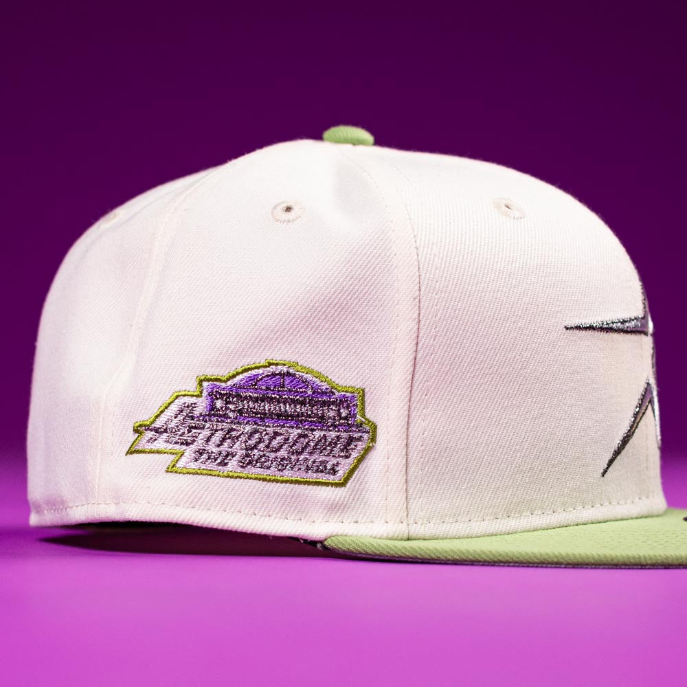 The Matcha Guy Houston Astros 5950 Fitted New Era Hat in white and light green features a purple and green side patch with badge-style embroidery, displayed on a purple background.