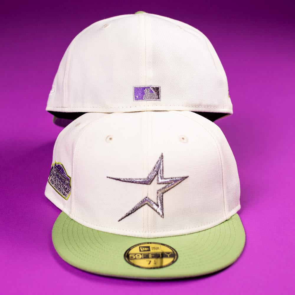 Two Matcha Guy Houston Astros 5950 New Era fitted hats with white crowns and light green brims are shown on a purple background. One displays a silver star logo and patch; the other shows the MLB logo above the strap.