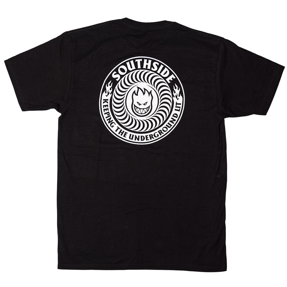 Southside x Spitfire KTUL Pinwheel Black Tee in black, featuring a large white circular logo on the back with “Southside Skatepark” and “KEEPING THE UNDERGROUND LIT” encircling a stylized flame face inspired by the Underground Lit Pinwheel.