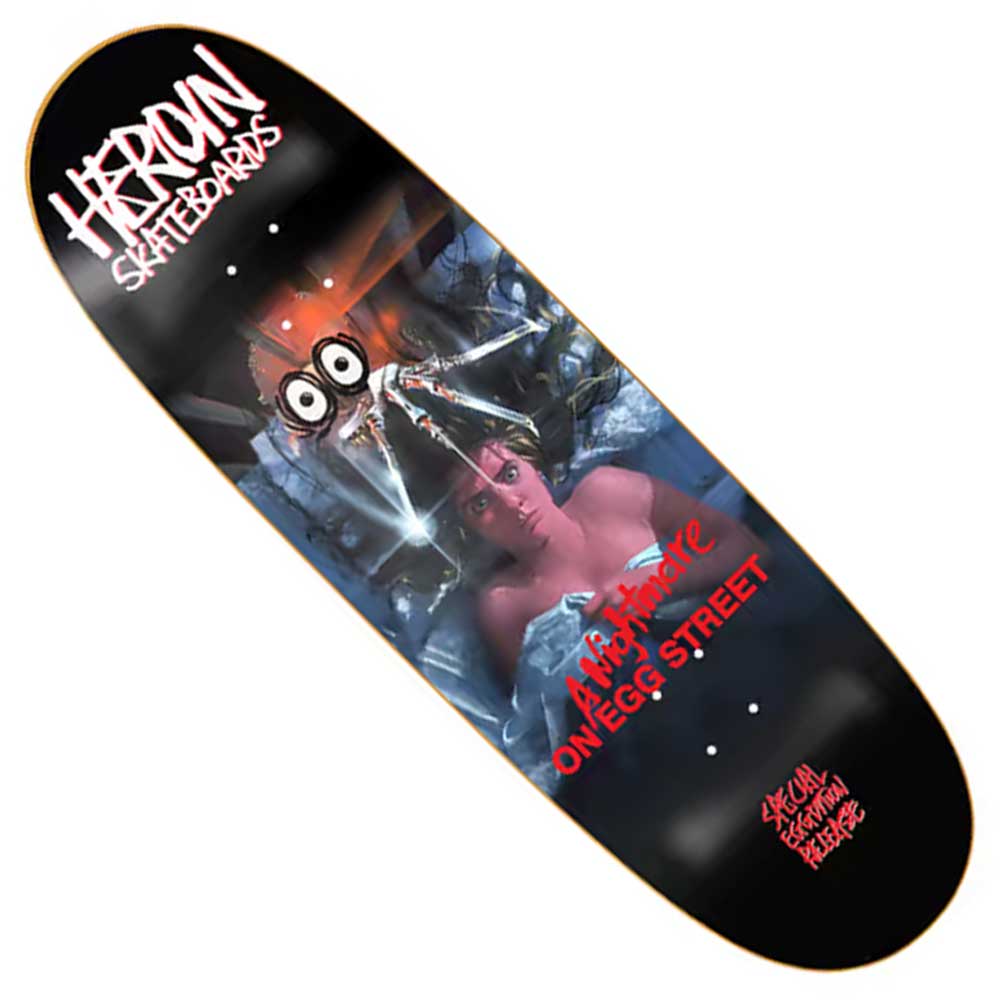 A Nightmare On Egg Street 9.87″ Shaped Deck from Heroin Skateboards, featuring horror-themed artwork of a frightened woman in bed and a cartoonish creature above her, with HEROIN SKATEBOARDS written at the top.