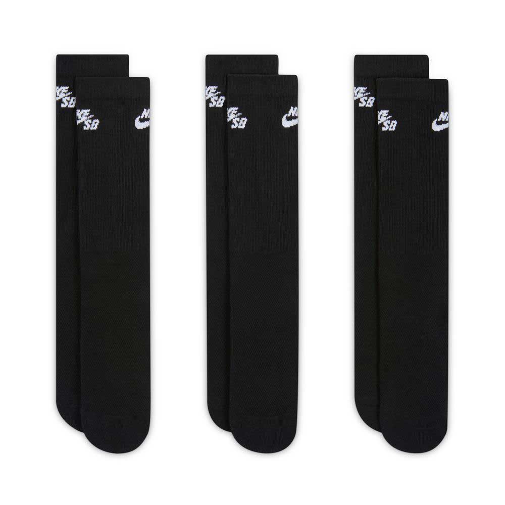 Three pairs of Nike SB Everyday Elevated Black White Crew Socks (3 Pack, style IR1328900) are laid flat side by side. Each black crew sock features a white Nike SB logo near the top and is crafted with Dri-FIT technology to help keep your feet cool and dry. The cushioned socks appear new and unworn against a white background.