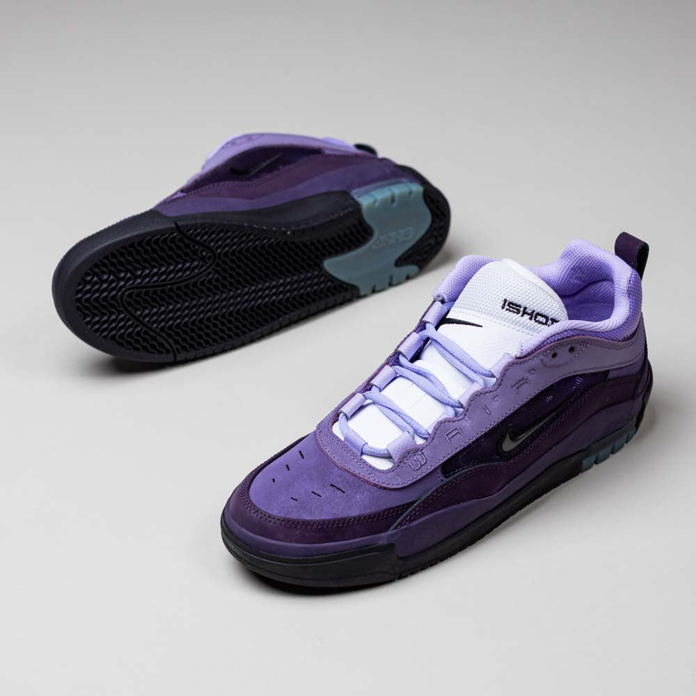 The Black Noble Purple IR1887500 Air MAX Ishod Nike SB Skateboarding Shoes feature white laces and detailing. Displayed on a light gray surface, one shoe stands upright while the other is tilted to reveal Max Air cushioning for comfort.