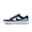 The Nike SB Force 58 "Light Armory Blue Thunder Photon Dust" DV5477-404 is a suede skateboarding shoe with heritage basketball style, a white sole, navy laces, and navy, sky blue, and white panels accented by the iconic Swoosh.