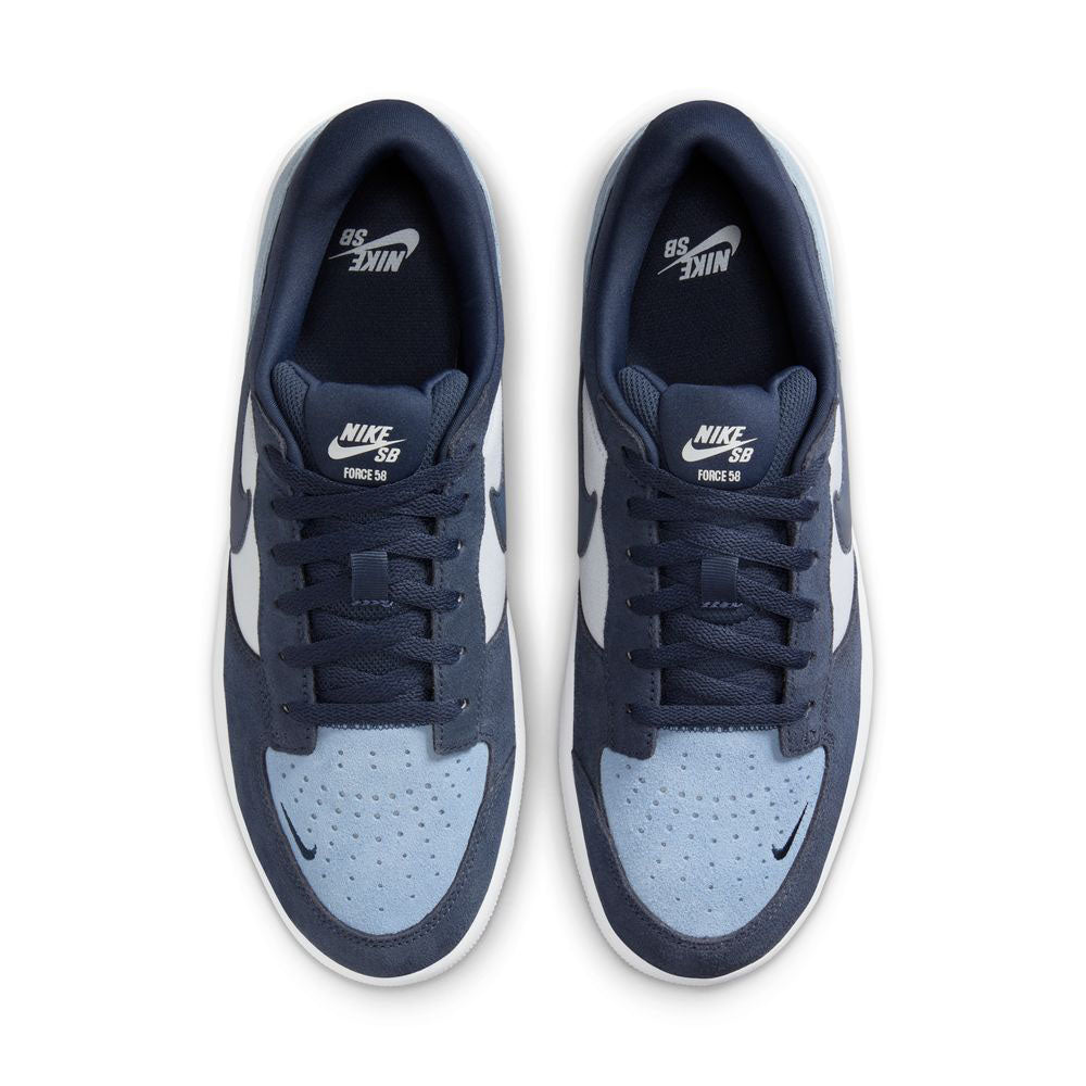 Top view of Force 58 Nike SB suede skate shoes in Light Armory Blue/Thunder Photon Dust—sporting white midsoles, black laces, and Nike tongue logos for a modern skate look inspired by basketball heritage.