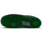 Green circular tread pattern on the outsole of an AF1 Cool Grey Court Green Black IV5289003 Nike SB Suede Skateboarding Shoe with a black midsole.
