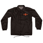 The OGBC Legacy Coach Windbreaker Longsleeve Jacket Black Red by Independent features a collar, elastic cuffs, drawstring hem, and orange-black Legacy cross logo on the chest—ideal as a classic skateboarding jacket for men.