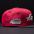 Introducing the Bloodline OG Cardinal Red Houston Astros New Era Hat 5950 Fitted: a maroon and black fitted cap with striking Cardinal Red accents, showcasing part of a silver Houston Astros logo on the front and finished with an Astrodome The Original patch on the side.