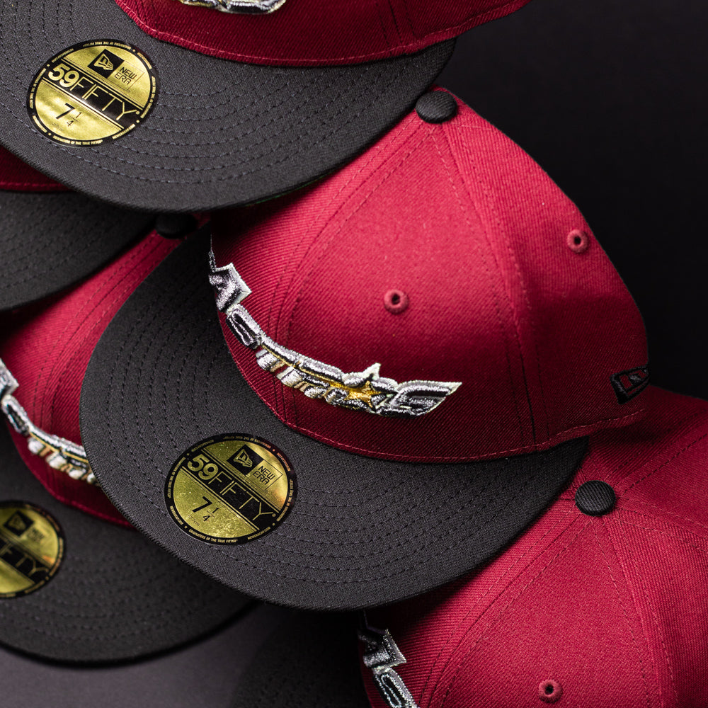 Stacked Bloodline OG Cardinal Red Houston Astros New Era 5950 fitted hats with black brims, featuring the signature star logo and bold lettering, each adorned with a shiny gold size sticker labeled 7 1/2.
