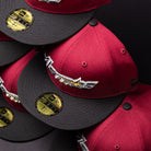 Stacked Bloodline OG Cardinal Red Houston Astros New Era 5950 fitted hats with black brims, featuring the signature star logo and bold lettering, each adorned with a shiny gold size sticker labeled 7 1/2.