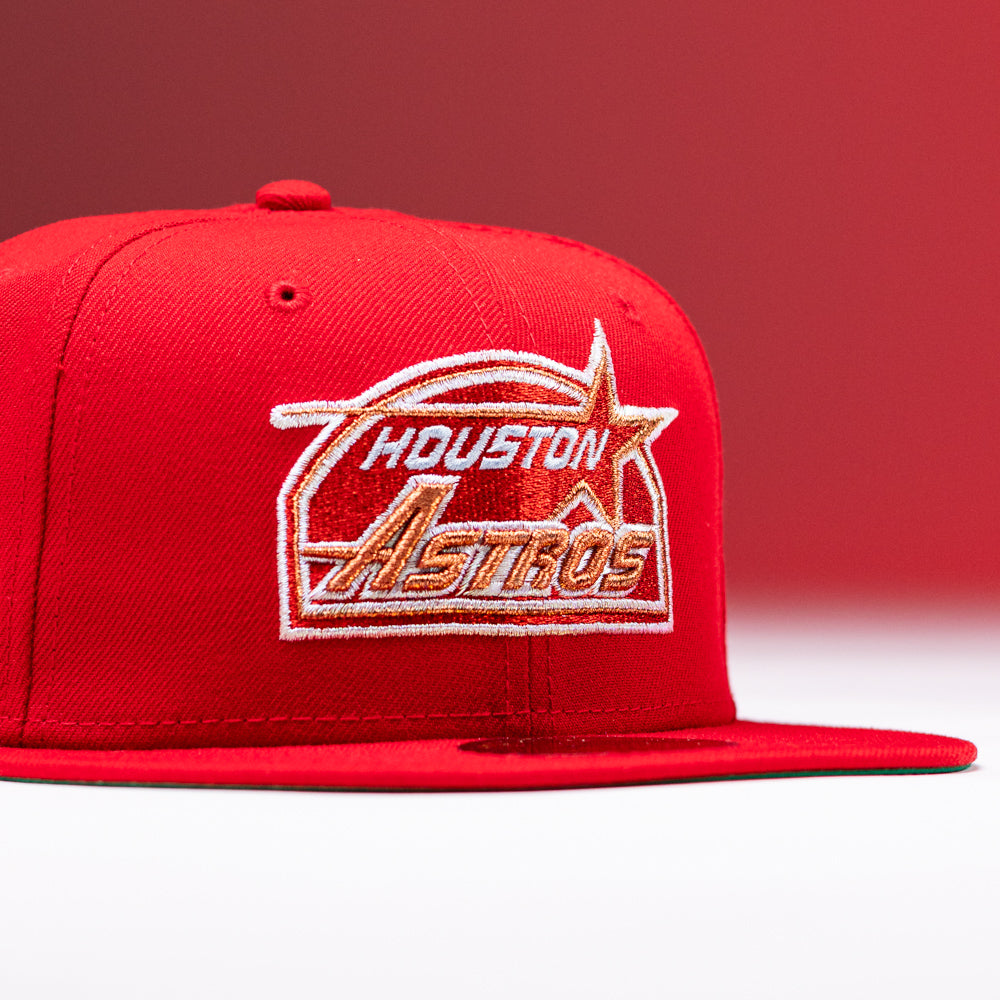 The H Town South Houston Astros New Era Hat 5950 Fitted features a white and orange embroidered team logo on the front, set against a bold red background.